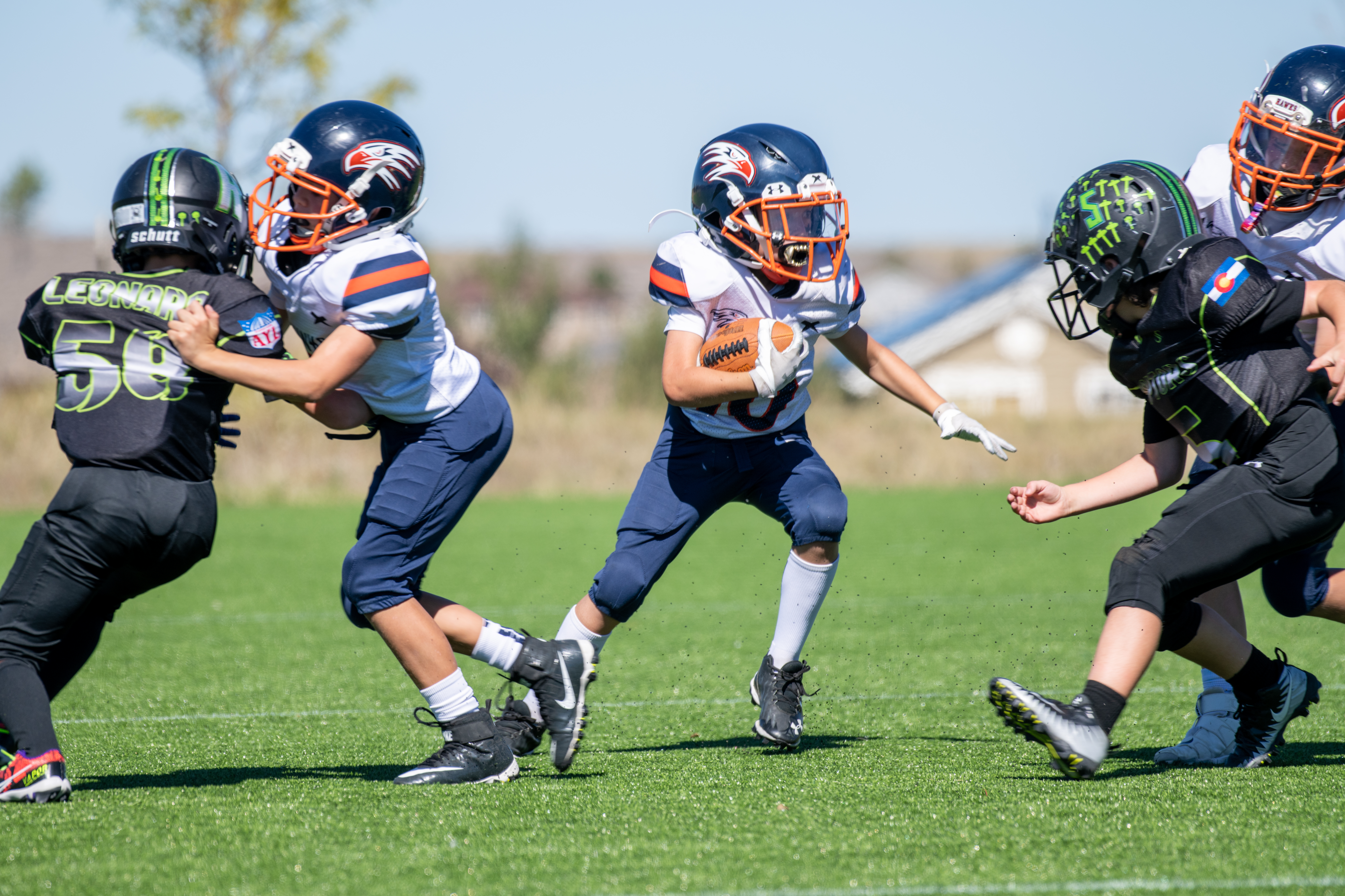 Football player demonstrating a running back drill