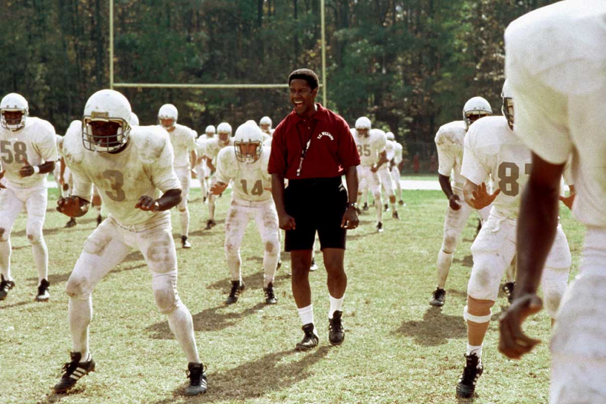 Players performing football conditioning drills